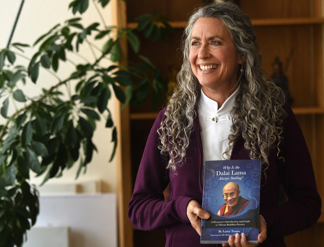 Lama Tsomo with her book Why is the Dalai Lama Always Smiling